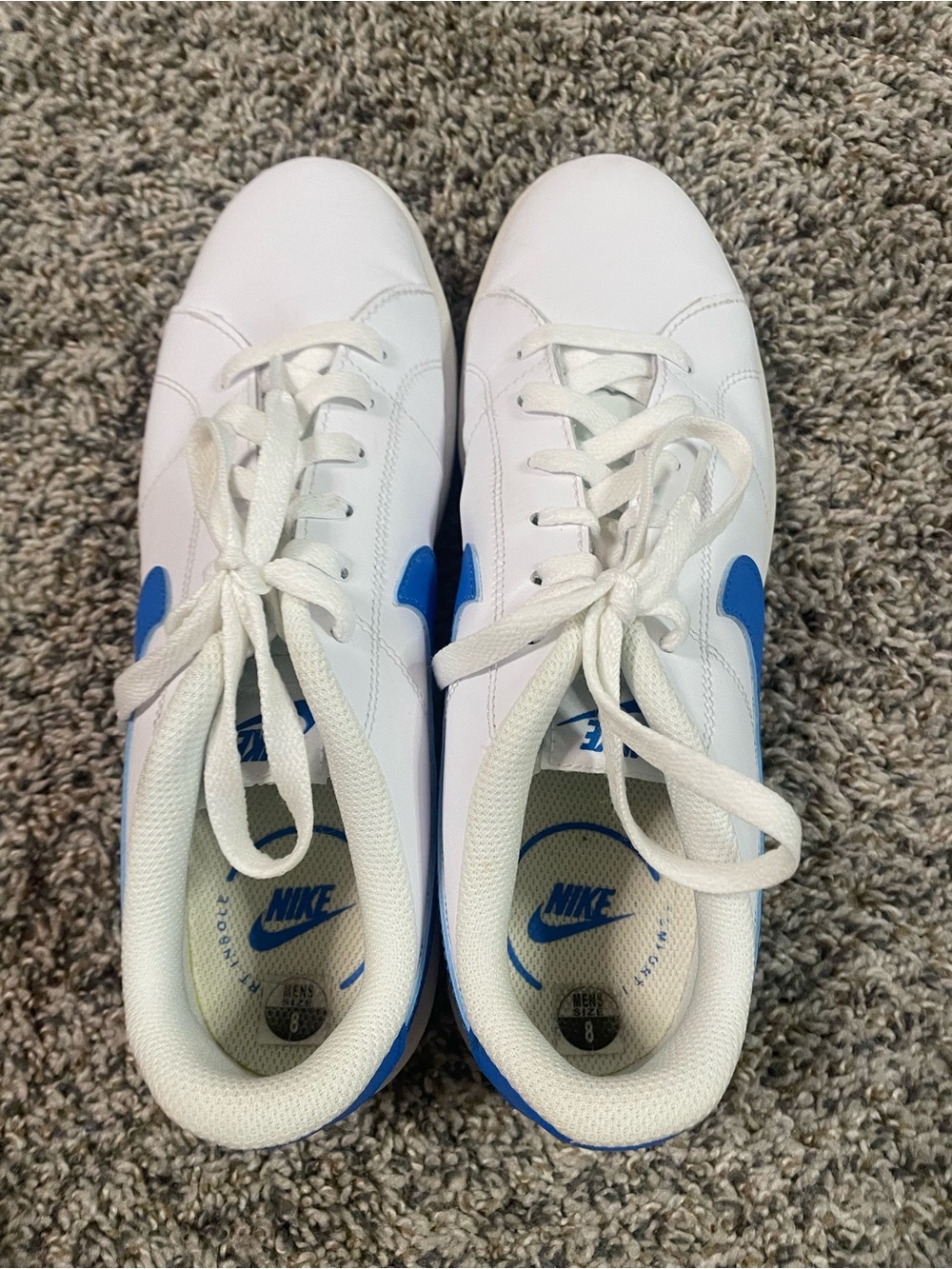 Nike White Sneakers with Blue Swoosh Accents